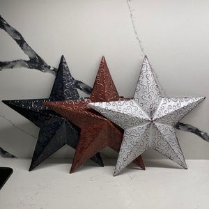 3 metal stars, 11 inches tall, can be hung or propped against something